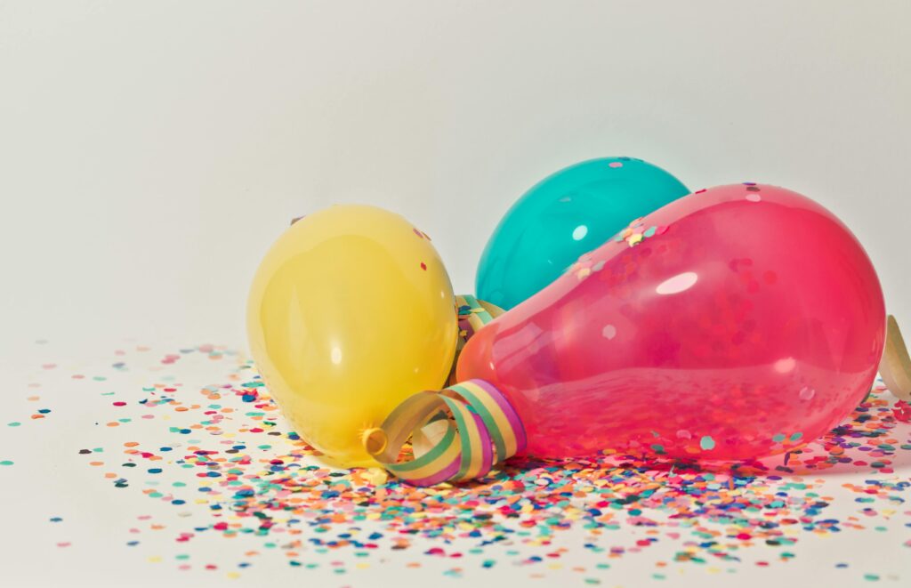 pexels photo 796606 796606 Vibrant colorful balloons surrounded by confetti, perfect for party celebrations.